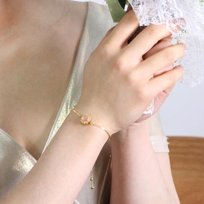 | Gold Brass Bracelet | Glass Floral Engraved Adjustable Chain | Elegant Positive Energy Charm | Everyday Wear Friendship Accessory - color: Pink