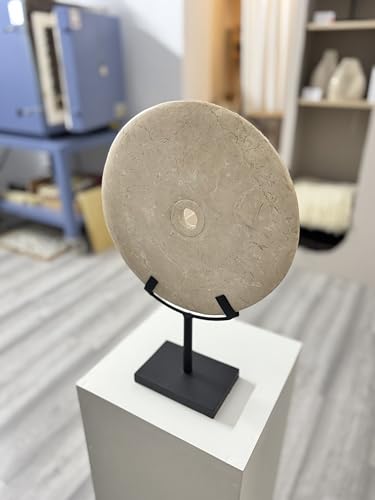 Elegant white decorative stone disc in oriental style, enhanced on a matte black metal base ideal to complement interiors with modern, zen or eclectic styles