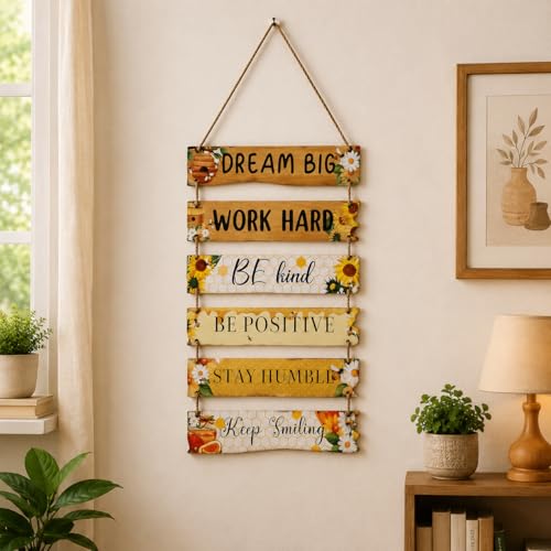 Crafter's Delight This inspirational hanging wall décor features a collection of uplifting motivational quotes beautifully displayed on connected wooden-style panels. Designed with floral accents and warm rustic tones, it adds positivity, charm, and a che