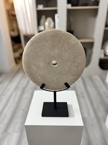 Elegant white decorative stone disc in oriental style, enhanced on a matte black metal base ideal to complement interiors with modern, zen or eclectic styles