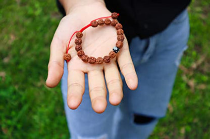 Hands of Tibet Tibetan Mala Rudraksha Seed Wrist Mala Bracelet with Carved Om Mani Conch Shell Spacer Free Silk Pouch