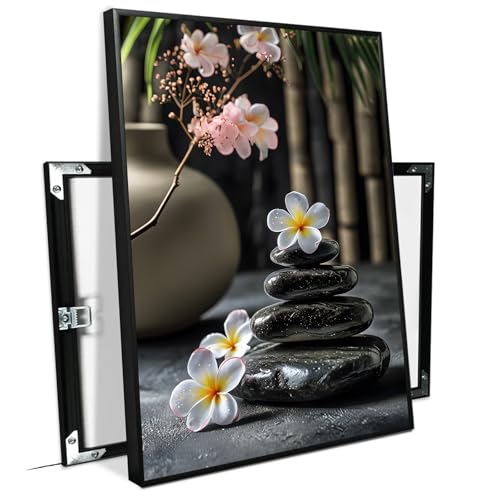 A harmonious black stone stack paired with white and pink flowers bamboo and ceramic vases creates a tranquil Zen decor for minimalist homes and mindful spaces 12x18in Metal blackFramed - color: Tranquil Stone, size: 12x16in Black Framed